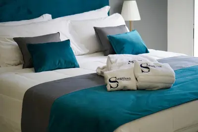 Letto o letti in una camera di Scugnizzo Apartment CHIAIA