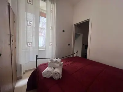 Letto o letti in una camera di Tribunali Cozy Apartment