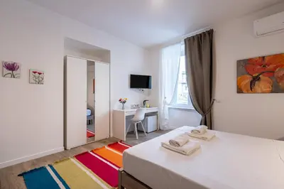 Letto o letti in una camera di Eleven11 Naples