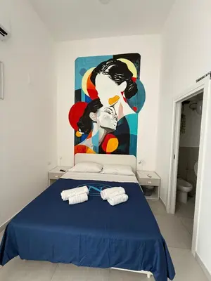Letto o letti in una camera di OIVITA by LUGANI B&B COLLECTION