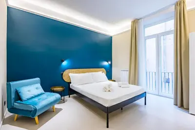 Letto o letti in una camera di Modern Spacious Apartment in the Heart of Naples