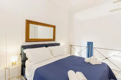 Letto o letti in una camera di Atri Rooms Centro Storico Napoli