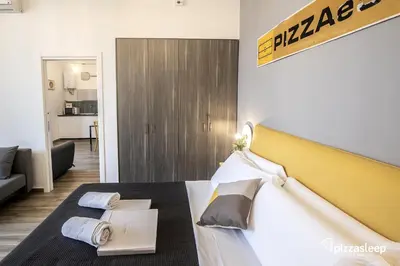 Letto o letti in una camera di pizzasleep Station