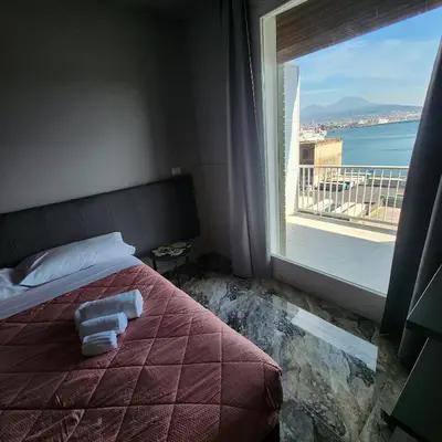 Letto o letti in una camera di Mia Suites Angioino