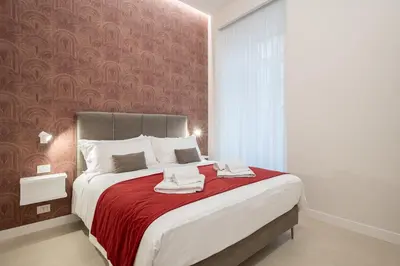Letto o letti in una camera di Na'more Rooms