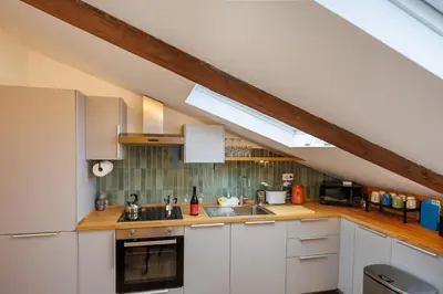 Cucina o angolo cottura di Exclusive Spaccanapoli Penthouse-Terrace with Lift By HouseinNaples