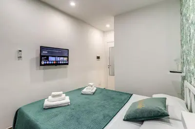 Letto o letti in una camera di Casa Dora