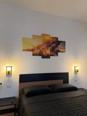 Letto o letti in una camera di CIAO PARTENOPE - luxury rooms