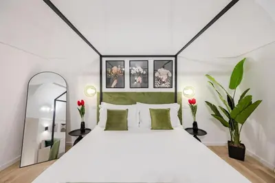 Letto o letti in una camera di Mama Apartment