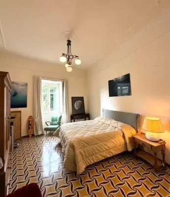 Letto o letti in una camera di Historic Vomero Apartment with Secluded Patio