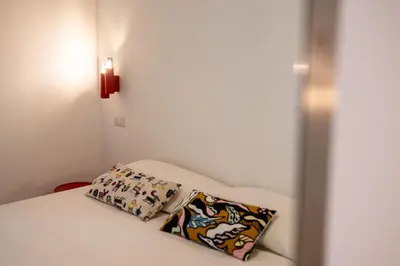 Letto o letti in una camera di Maison Noir Napoli
