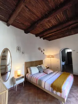 Letto o letti in una camera di Regina Partenope Home