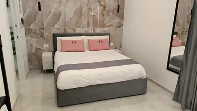Letto o letti in una camera di Le Coccinelle - B&B Napoli