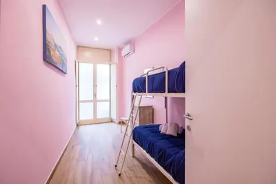 Letto o letti in una camera di Muzy flat at Capuana by NapoliApartments