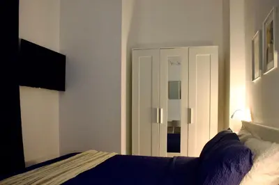 Letto o letti in una camera di Guest House dei Poeti