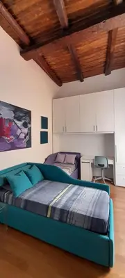 Letto o letti in una camera di Casa dell'Architetto