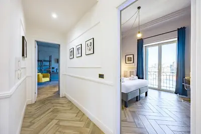 Letto o letti in una camera di Elite Art Palace by Napoliapartments