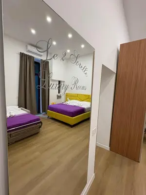 Letto o letti in una camera di Le 2 sorelle Luxury Rooms