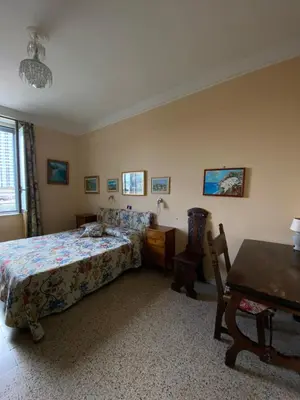 Letto o letti in una camera di B&b la stufa