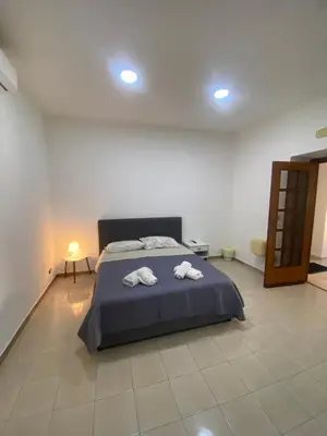 Letto o letti in una camera di Eva Rooms Stazione Garibaldi