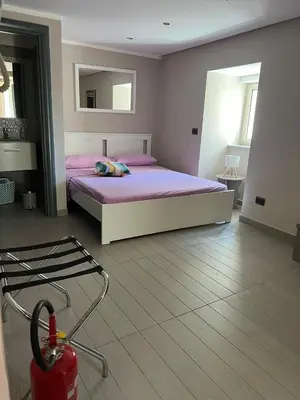 Letto o letti in una camera di Lola suite Napoli