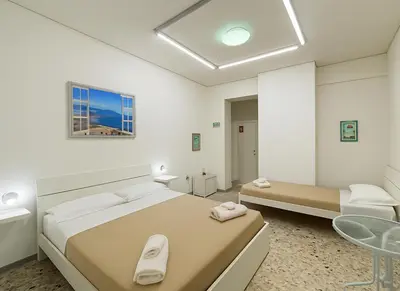 Letto o letti in una camera di NaNàpolis Stay