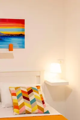 Letto o letti in una camera di Bobbò house V il giardino a santa chiara