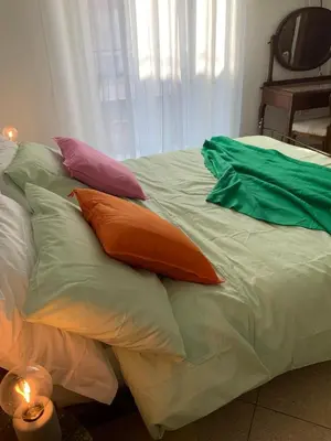 Letto o letti in una camera di Rosa e Peperoncino