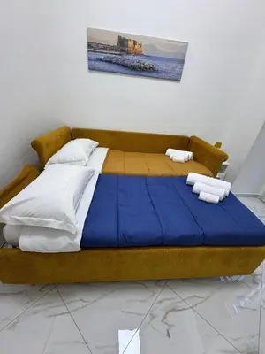 Letto o letti in una camera di Residenza Castel Capuano