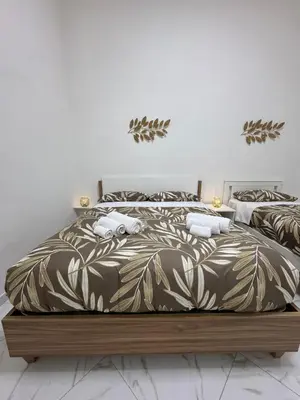 Letto o letti in una camera di Residenza Castel Capuano
