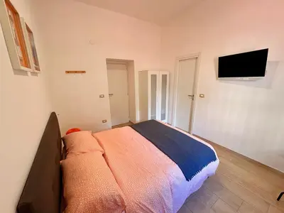 Letto o letti in una camera di A casa di Luca Napoli