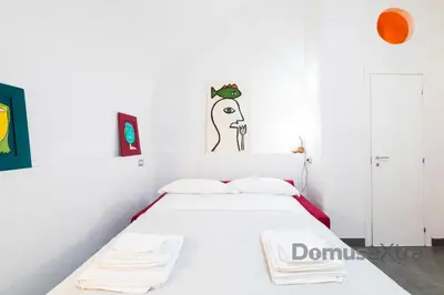 Letto o letti in una camera di Gatto Giallo a Chiaia By DomusExtra