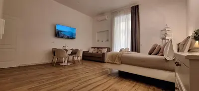 Letto o letti in una camera di L'AMI Chiaia Suite