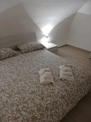 Letto o letti in una camera di MarcoHomeChiaia