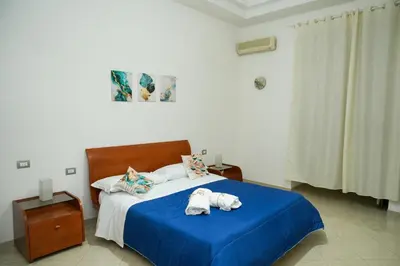 Letto o letti in una camera di Dimora Laezza