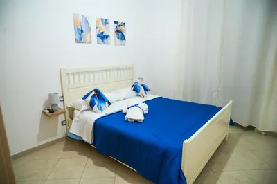 Letto o letti in una camera di Dimora Laezza