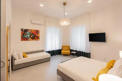Letto o letti in una camera di VISI di NAPOLI