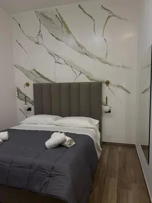 Letto o letti in una camera di Maison Ecce Hom0