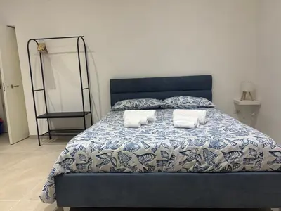 Letto o letti in una camera di Cavallerizza home al museo
