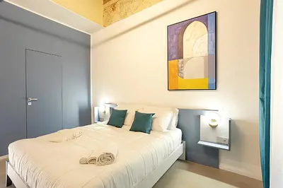 Letto o letti in una camera di Mo' Vediamo rooms