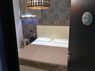 Letto o letti in una camera di Terrazza Partenopea