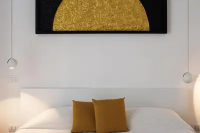 Letto o letti in una camera di Magma Home - Rooms & Roof