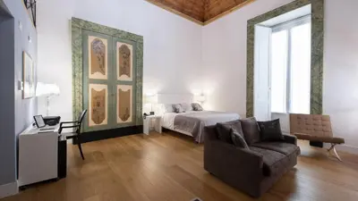 Letto o letti in una camera di Santa Chiara Boutique Hotel