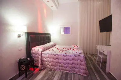 Letto o letti in una camera di Napoli Garibaldi Square