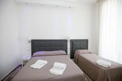 Letto o letti in una camera di Napoli Garibaldi Square