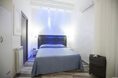 Letto o letti in una camera di Napoli Garibaldi Square