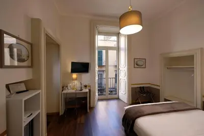 Letto o letti in una camera di Napoli Class