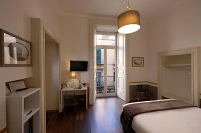 Letto o letti in una camera di Napoli Class