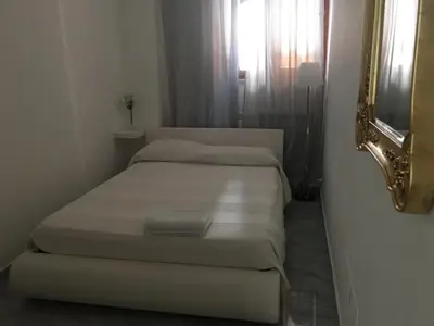 Letto o letti in una camera di Supera Napoli Apartment