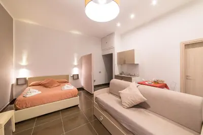 Letto o letti in una camera di Be Italian Flat Bovio